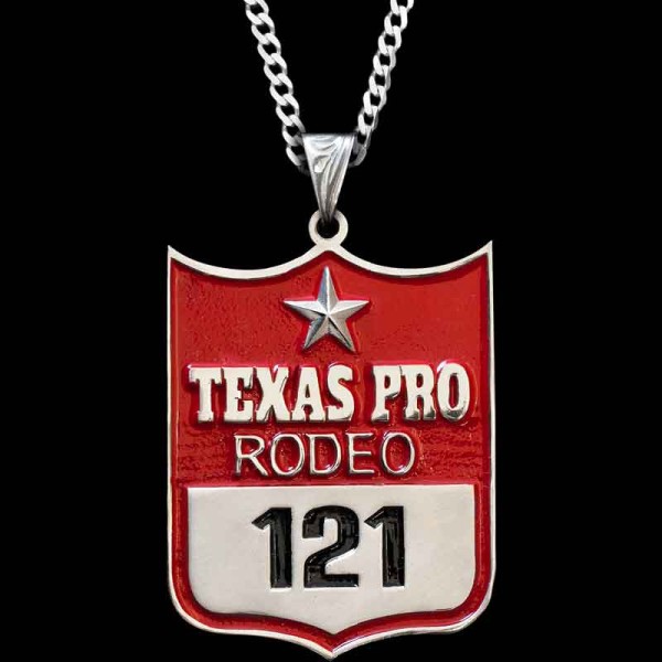 Customize the Rodeo Backnumber Pendant with your Event name and Backnumber! Perfect for rodeo awards, gifts or for your personal western style. Crafted on a German Silver base, detailed with red enamel & German Silver lettering.

Pair with a sterlin